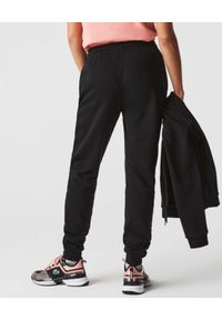 Lacoste - LACOSTE - Czarne spodnie dresowe z logo. Kolor: czarny. Materiał: dresówka #2