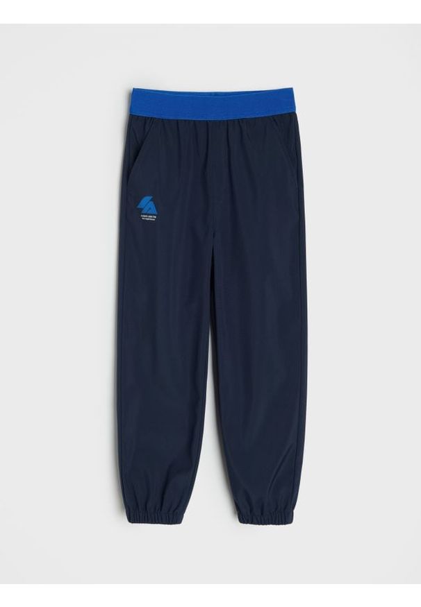 Sinsay - Spodnie hikingowe Active - granatowy. Kolor: niebieski