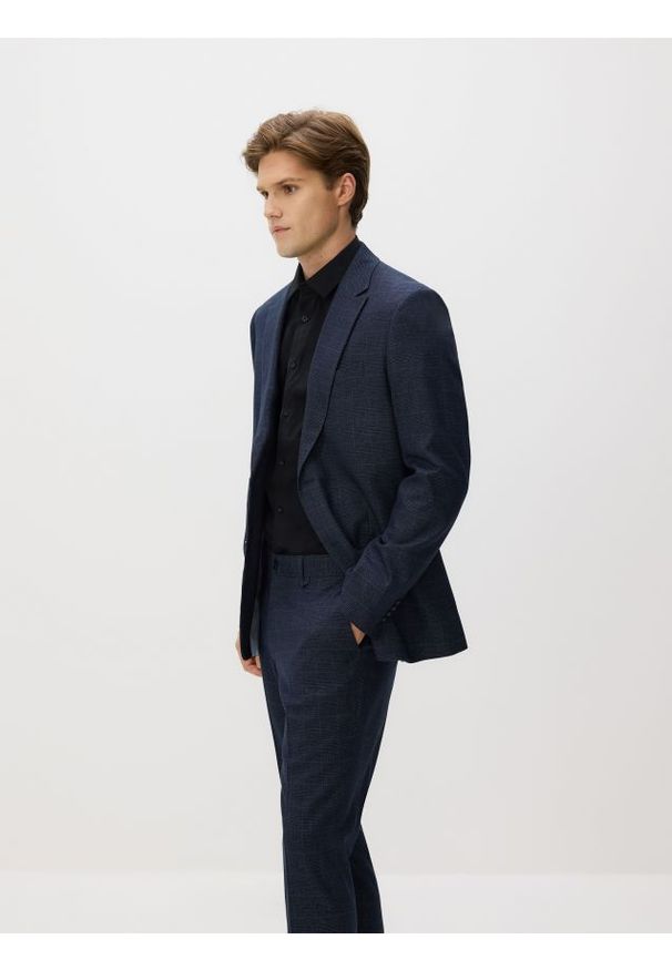 Reserved - Spodnie garniturowe slim fit - granatowy. Kolor: niebieski. Materiał: tkanina