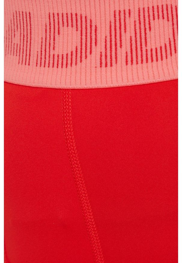 adidas Performance legginsy treningowe damskie kolor czerwony z aplikacją. Kolor: czerwony. Materiał: skóra, poliester, dzianina, materiał. Wzór: aplikacja. Sport: fitness