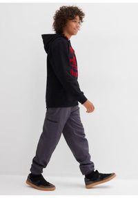 bonprix - Ocieplane spodnie bojówki z dżersejową podszewką o kroju loose fit. Kolor: szary. Materiał: jersey