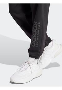 Adidas - adidas Spodnie dresowe ALL SZN Fleece Graphic IW1201 Czarny Regular Fit. Kolor: czarny. Materiał: bawełna #2
