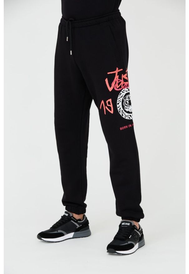 Just Cavalli - JUST CAVALLI Czarne męskie spodnie z nadrukiem R 1998 Dripp, Rozmiar M. Kolor: czarny. Wzór: nadruk