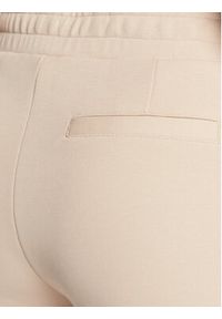 Calvin Klein Spodnie dresowe Micro Logo Essential K20K204424 Beżowy Regular Fit. Kolor: beżowy. Materiał: bawełna, dresówka