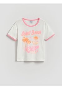 Reserved - T-shirt z brokatowym nadrukiem - złamana biel. Materiał: bawełna. Wzór: nadruk
