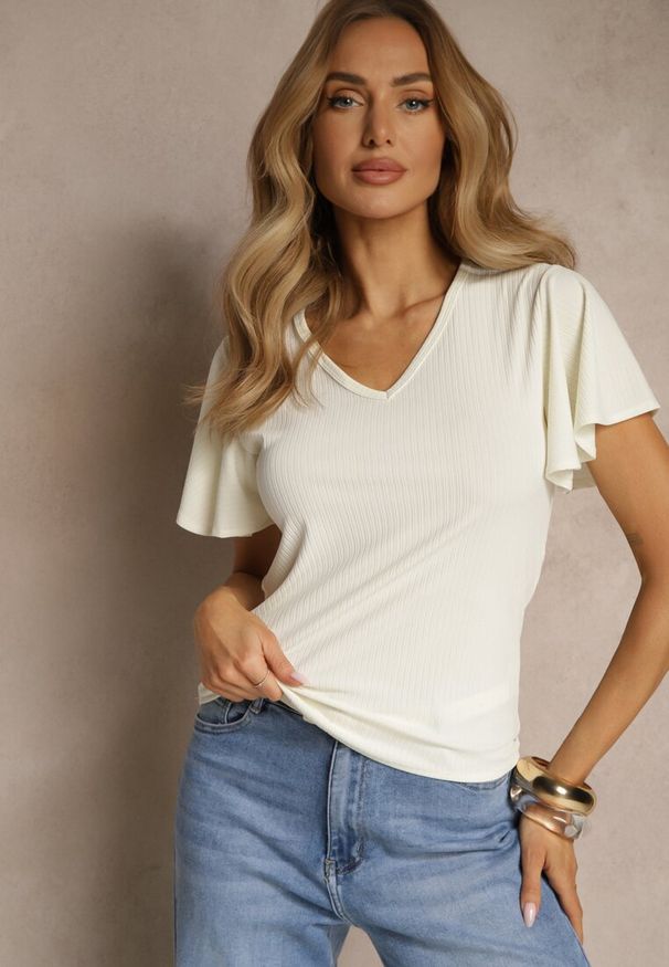 Renee - Beżowa Bluzka Ozdobiona Rozkloszowanymi Rękawami Sunetha. Okazja: na co dzień. Typ kołnierza: dekolt w kształcie V. Kolor: beżowy. Materiał: jeans. Wzór: aplikacja. Styl: elegancki, casual