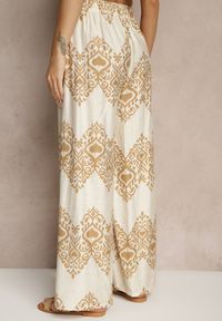 Renee - Beżowe Spodnie z Wiskozy o Szerokim Kroju High Waist ze Wzorem Boho Neolissea. Okazja: na co dzień, na spacer. Stan: podwyższony. Kolor: beżowy. Materiał: wiskoza. Sezon: lato. Styl: boho #5