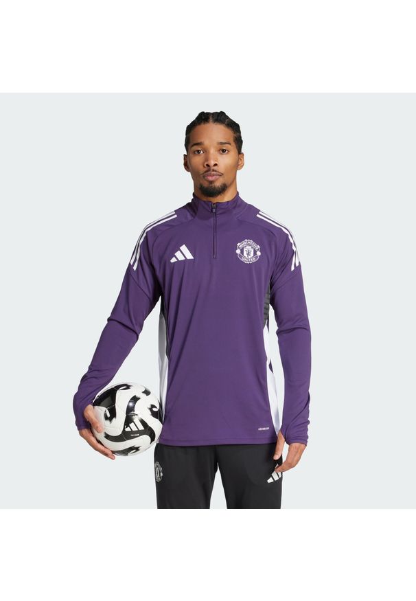 Adidas - Bluza Manchester United Tiro 25 Competition Training. Kolor: fioletowy, biały, wielokolorowy, czarny. Materiał: dresówka. Sport: piłka nożna