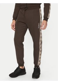 Guess Spodnie dresowe Z2YB09 KB3P2 Brązowy Regular Fit. Kolor: brązowy. Materiał: bawełna, syntetyk