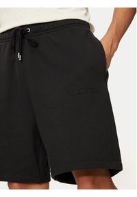 Nike Szorty sportowe FJ0700 Czarny Regular Fit. Kolor: czarny. Materiał: bawełna. Styl: sportowy