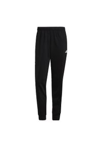 Adidas - Spodnie męskie adidas Primegreen Essentials Warm-Up Tapered 3-Stripes Track. Kolor: czarny, biały, wielokolorowy. Materiał: dresówka, poliester, materiał. Sport: fitness