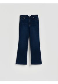 Reserved - Jeansy bootcut - granatowy. Kolor: niebieski