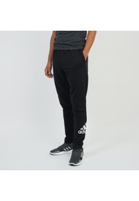 Adidas - Spodnie dresowe męskie. Materiał: bawełna, poliester. Sport: joga i pilates #1