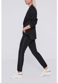Karl Lagerfeld Spodnie damskie kolor czarny dopasowane medium waist. Kolor: czarny. Materiał: dzianina