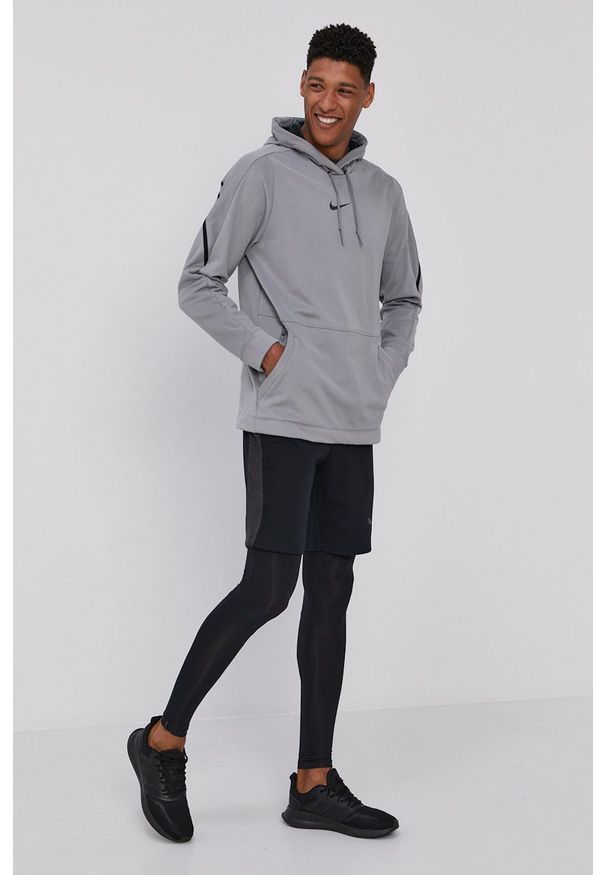 Nike Bluza męska kolor szary z kapturem gładka. Typ kołnierza: kaptur. Kolor: szary. Materiał: skóra, włókno, tkanina. Wzór: gładki