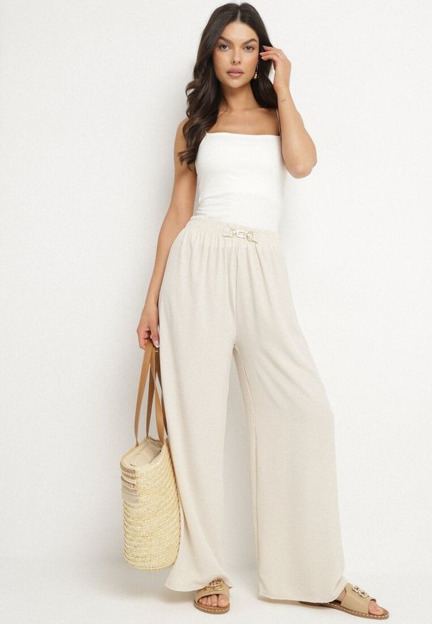 Born2be - Jasnobeżowe Szerokie Spodnie z Gumką w Pasie Sliverta. Kolor: beżowy