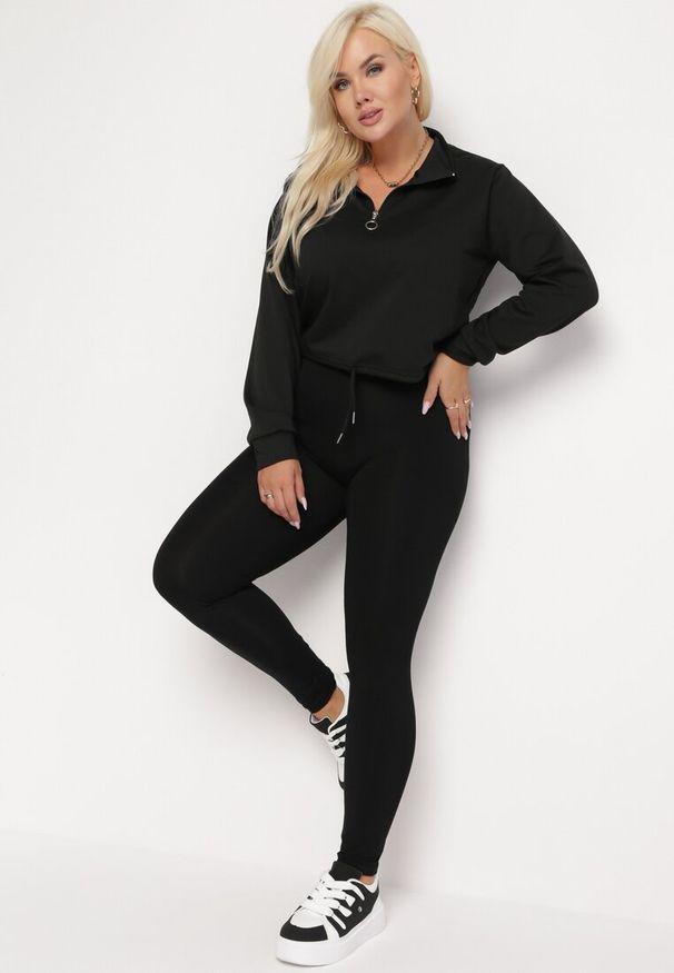 Born2be - Czarne Legginsy ze Zwężanymi Nogawkami Okannera. Kolor: czarny. Materiał: tkanina
