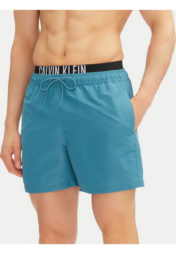 Calvin Klein Swimwear Szorty kąpielowe KM0KM01093 Niebieski Regular Fit. Kolor: niebieski. Materiał: syntetyk