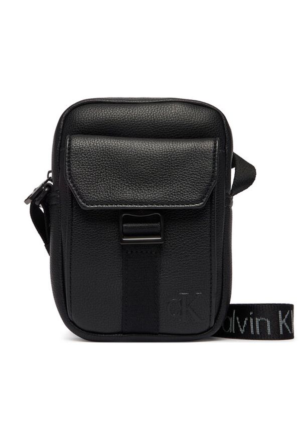 Calvin Klein Saszetka Webbing Strap Slim Reporter LV04D3281G Czarny. Kolor: czarny. Materiał: skóra