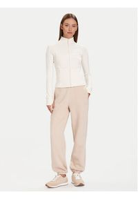 Guess Spodnie dresowe V5BB10 KB681 Beżowy Regular Fit. Kolor: beżowy. Materiał: syntetyk