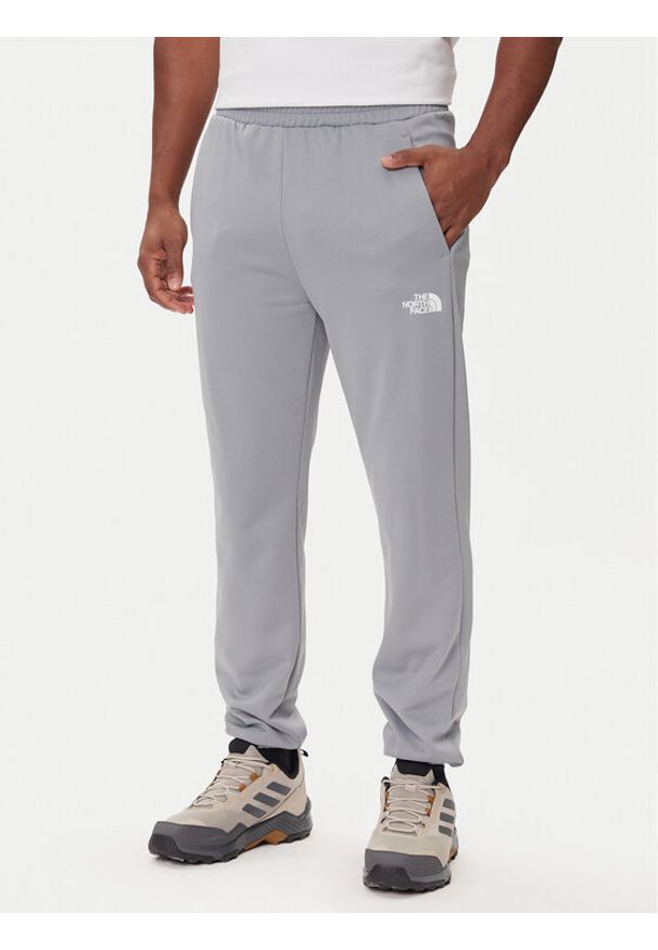 The North Face Spodnie dresowe Reaxion 2.0 NF0A8DRS Szary Regular Fit. Kolor: szary. Materiał: syntetyk