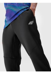 4f - Spodnie treningowe szybkoschnące męskie - czarne. Kolor: czarny. Materiał: materiał, syntetyk, elastan, dzianina, włókno. Wzór: jednolity, ze splotem. Sport: fitness