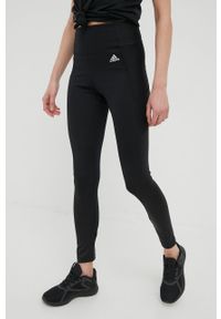 Adidas - adidas legginsy treningowe x Zoe Saldana damskie kolor czarny gładkie. Kolor: czarny. Materiał: skóra, dzianina, materiał. Wzór: gładki. Sport: fitness