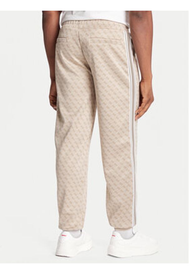 Guess Spodnie dresowe Z5BB19 K2042 Niebieski Regular Fit. Kolor: niebieski. Materiał: syntetyk
