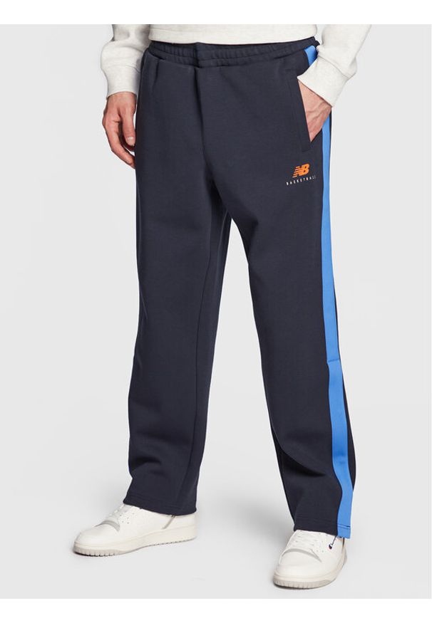 New Balance Spodnie dresowe MP23588 Granatowy Relaxed Fit. Kolor: niebieski. Materiał: syntetyk, dresówka