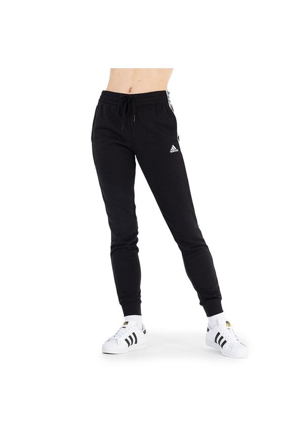 Adidas - Spodnie adidas Essentials Fleece 3-Stripes GM5551 - czarne. Kolor: czarny. Materiał: bawełna, dresówka, poliester, wiskoza
