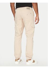 Guess Spodnie materiałowe M5RB54 WGXY1 Beżowy Slim Fit. Kolor: beżowy. Materiał: bawełna