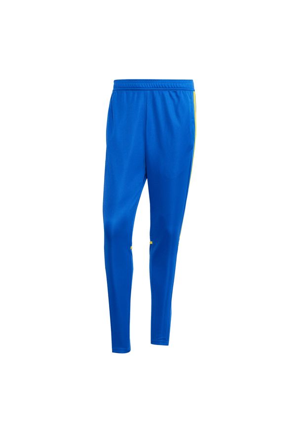Adidas - Spodnie treningowe adidas Squadra25. Kolor: żółty, niebieski, wielokolorowy. Materiał: poliester. Sport: piłka nożna