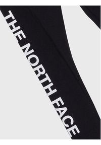 The North Face Legginsy Graphic NF0A82EQ Czarny Slim Fit. Kolor: czarny. Materiał: bawełna