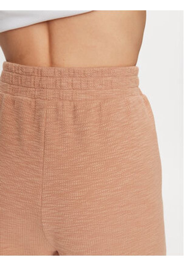 DKNY Sport Spodnie dresowe DP3P3286 Brązowy Regular Fit. Kolor: brązowy. Materiał: bawełna, syntetyk