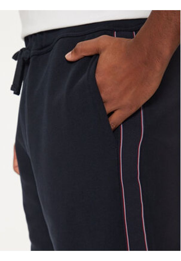 TOMMY HILFIGER - Tommy Hilfiger Spodnie dresowe MW0MW37477 Granatowy Regular Fit. Kolor: niebieski. Materiał: bawełna