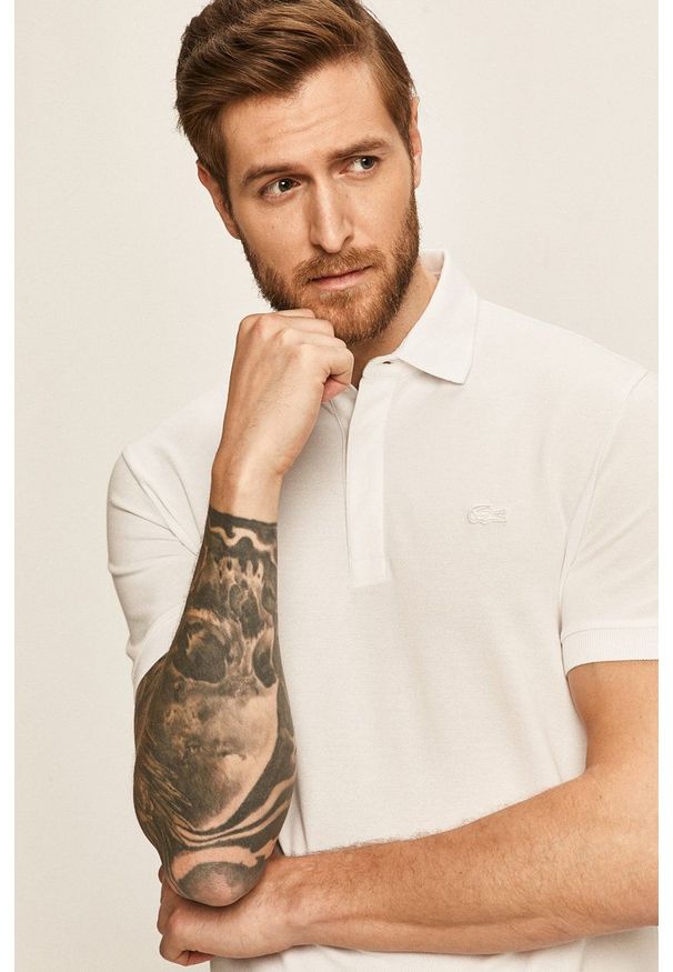 Lacoste - Polo. Okazja: na co dzień. Typ kołnierza: polo. Kolor: biały. Materiał: dzianina. Długość: krótkie. Styl: casual