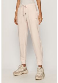 DKNY - Dkny - Spodnie. Kolor: różowy. Materiał: bawełna, poliester, dzianina. Wzór: gładki #1