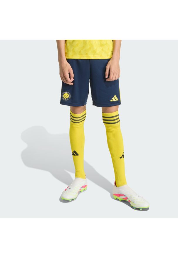 Adidas - Szorty Al Nassr FC 25/26 Home. Kolor: wielokolorowy, niebieski, żółty. Sport: piłka nożna