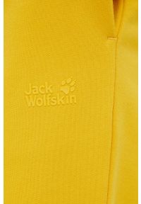 Jack Wolfskin spodnie dresowe bawełniane damskie kolor żółty gładkie. Kolor: żółty. Materiał: bawełna, dresówka. Wzór: gładki #3