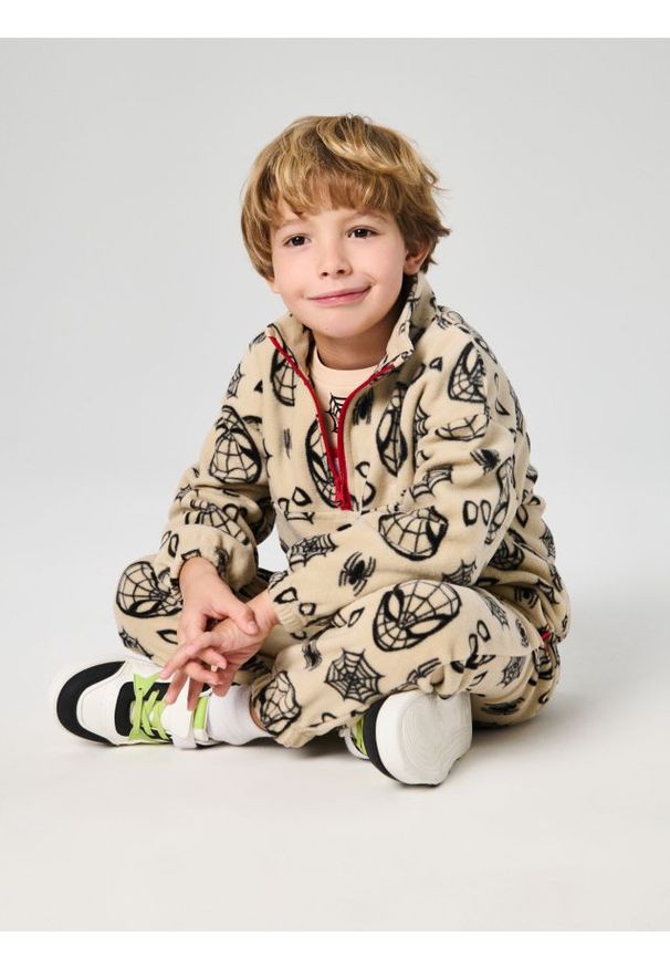 Sinsay - Spodnie jogger Spider-Man - beżowy. Kolor: beżowy