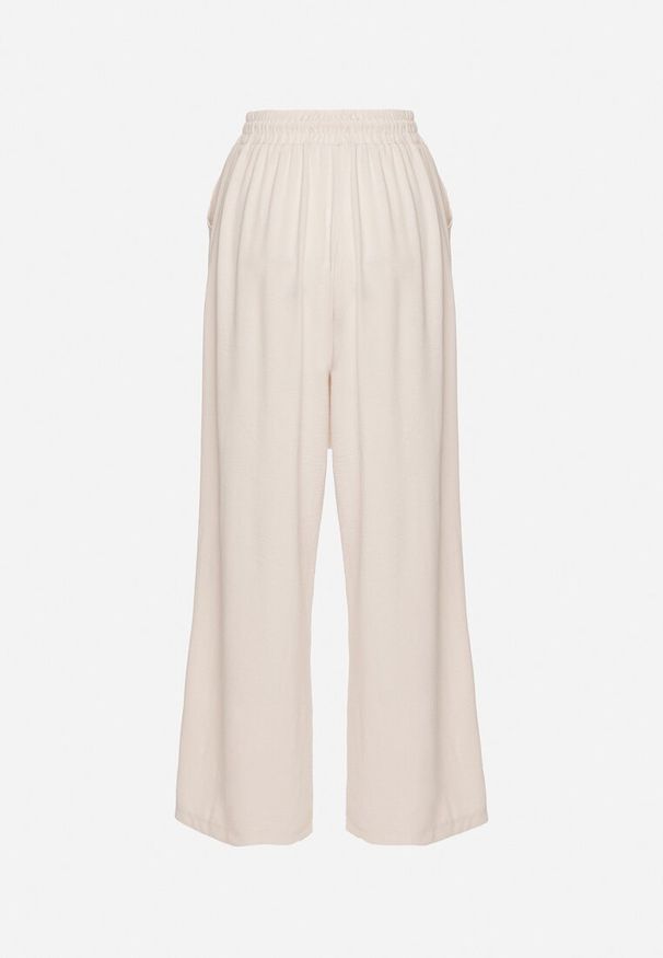 Born2be - Jasnobeżowe Spodnie z Wiskozą o Szerokim Kroju ze Ściągaczem w Talii Lavirre. Okazja: na co dzień. Kolor: beżowy. Materiał: wiskoza. Styl: wizytowy, klasyczny, casual