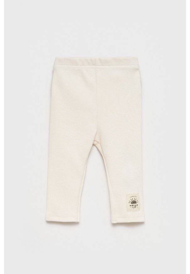 Jamiks legginsy dziecięce kolor beżowy gładkie. Kolor: beżowy. Materiał: dzianina. Wzór: gładki