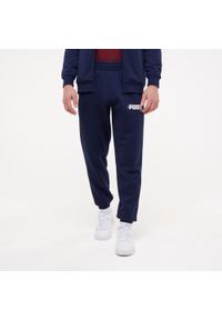 Spodnie dresowe męskie Puma Gym & Pilates. Kolor: niebieski. Materiał: dresówka. Sport: joga i pilates #1