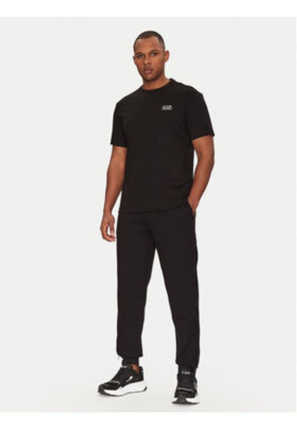 EA7 Emporio Armani Spodnie dresowe 7M000144 AF13538 UC001 Czarny Regular Fit. Kolor: czarny. Materiał: syntetyk, bawełna