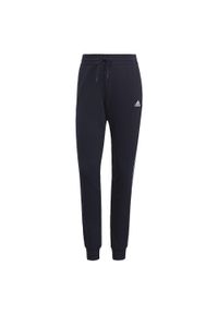 Adidas - Spodnie damskie adidas Essentials Slim Tapered Cuffed Pant. Kolor: biały, wielokolorowy, niebieski. Materiał: dresówka, bawełna, materiał. Długość: długie