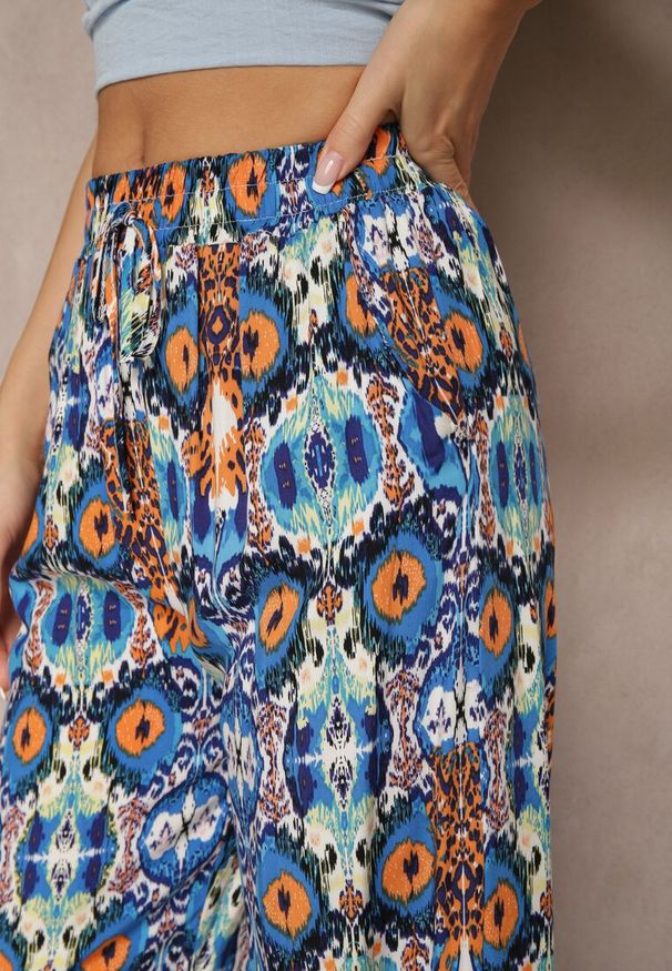 Renee - Niebieskie Bawełniane Spodnie High Waist Szerokie we Wzór Boho Tolioria. Okazja: na co dzień, do pracy. Stan: podwyższony. Kolor: niebieski. Materiał: bawełna. Styl: boho