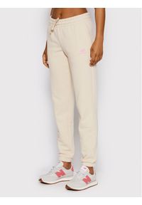 New Balance Spodnie dresowe WP21508 Beżowy Regular Fit. Kolor: beżowy. Materiał: dresówka, syntetyk