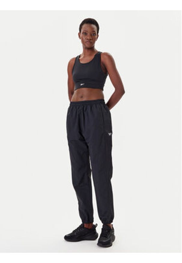 Reebok Spodnie dresowe Vector 100221435 Czarny Relaxed Fit. Kolor: czarny. Materiał: syntetyk