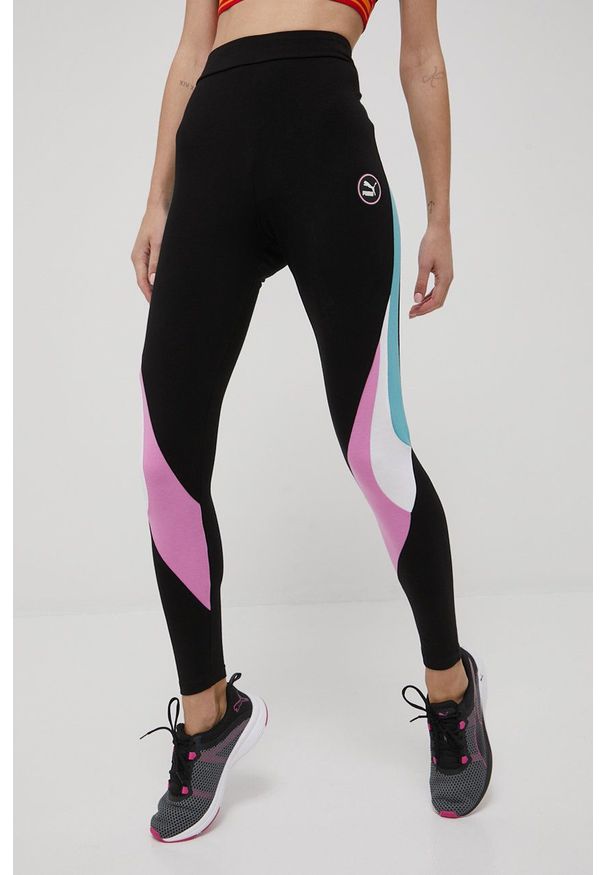 Puma legginsy SWxP 533575 damskie kolor czarny wzorzyste. Kolor: czarny. Materiał: skóra, bawełna, dzianina