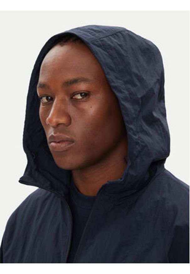 Tommy Jeans Wiatrówka Chicago DM0DM21393 Granatowy Regular Fit. Kolor: niebieski. Materiał: syntetyk